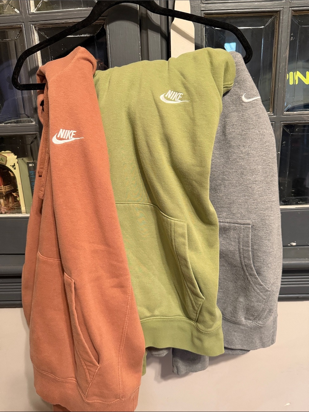 Nike Hoodies Trio in Rust, Olive, and Heather Gray